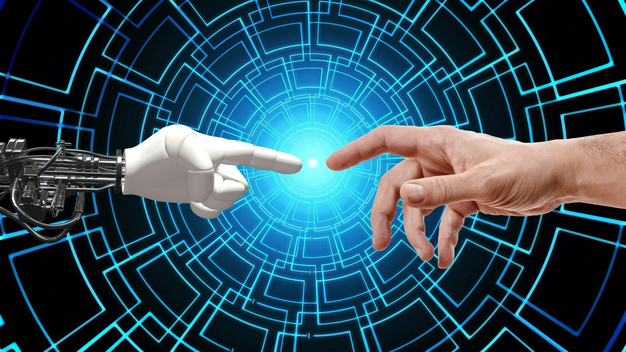 A robot ai voice hand reaching out to a freelancer human hand